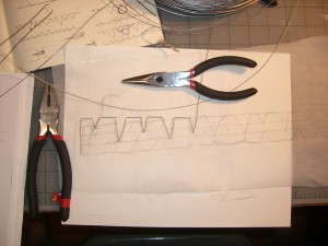 Some early bends of a wire choker/collar in progress