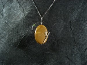 reverse side of Lonely Orbit stone and wire pendant
